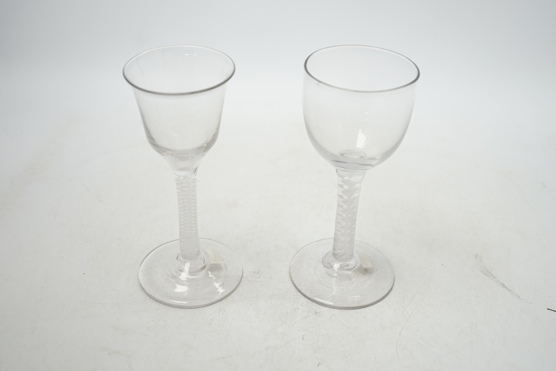 Two mid-18th century opaque twist cordial glasses, 15cm. Condition - good
